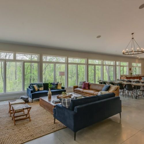 Beautiful Floor to Ceiling Windows line the Great Room letting nature rush in all around you!